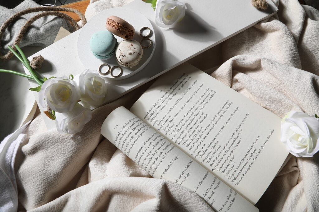 book, macarons, roses