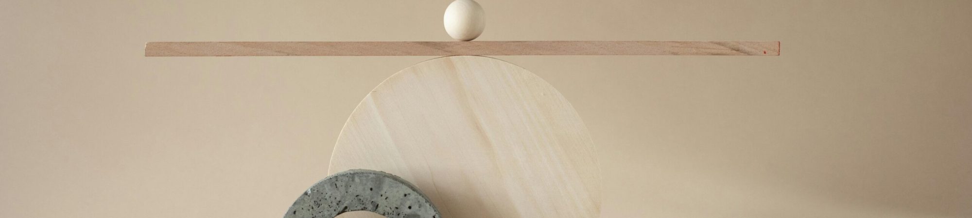 Abstract composition of geometric shapes and textures on a beige backdrop.